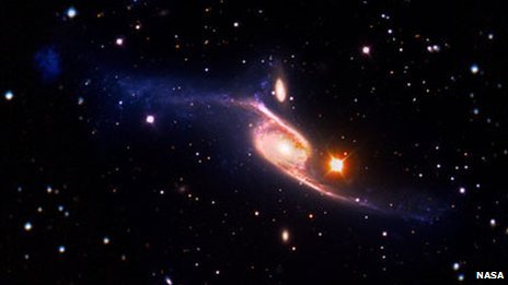 NASA image of the giant barred spiral galaxy NGC 6872